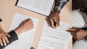Wooden House Model, Keys and Contract on Table